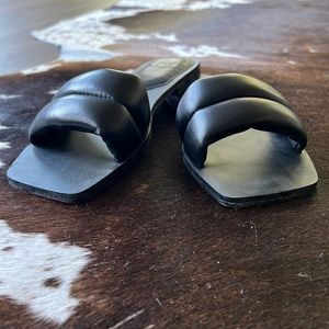 Black leather slides